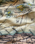 Close-up of a vintage map with text and geographical details.