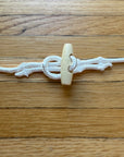 A Spacer for the Flags: Cordage, loop and toggle