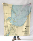 Map blanket with a person standing underneath on a white background